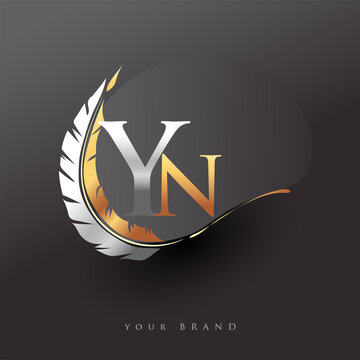 Initial letter YN logo with Feather Gold And Silver Color, Simple and Clean Design For Company Name. Vector Logo for Business and Company.