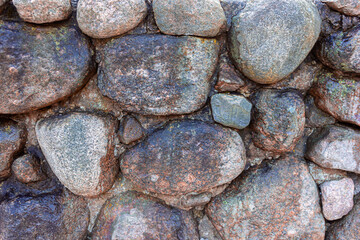 A stone wall. Old town. Stone fence