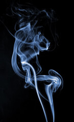 Blue curly smoke on a black background