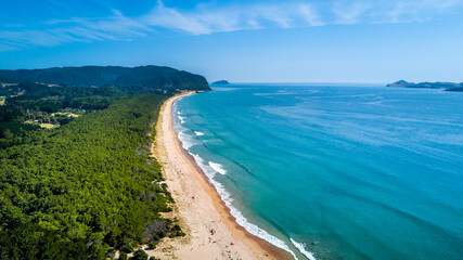 Aerial view of a sunny beach. Coromandel, New Zealand.