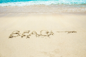 beautiful drawing on the sand near the sea shore background