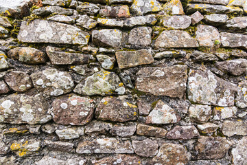 Stone wall structure with stones and moss