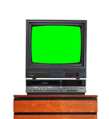 Old TV set with cut out green screen and VCR isolated on white, stand on vintage nightstand 1990s, 1980s.