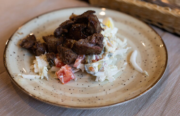 warm salad with chicken liver, cabbage and boiled egg