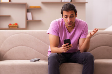 Young man staying at home during pandemic