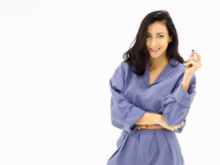 A white European woman  in blue work clothes standing with her arms folded for a photo shoot. Caucasian Woman Beautiful Portrait Studio On White Background.