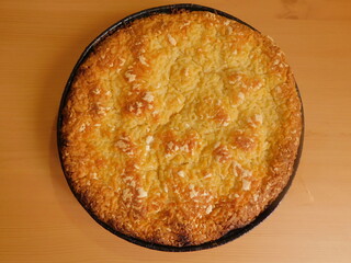 Freshly baked hot apple pie on wooden table