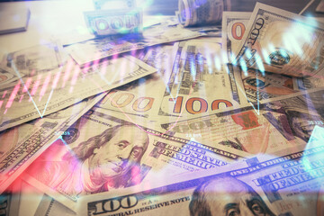 Multi exposure of forex chart drawing over us dollars bill background. Concept of financial success...
