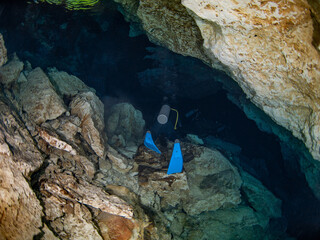 Scuba diving in a salactite underwater cave (Cenote Tajma Ha, Playa del Carmen, Quintana Roo, Mexico)