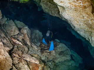 Scuba diving in a salactite underwater cave (Cenote Tajma Ha, Playa del Carmen, Quintana Roo,...