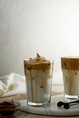 Iced dalgona coffee glasses, frothy creamy whipped coffee cold drink