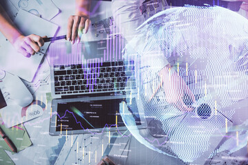 Double exposure of man and woman working together and financial graph hologram. Business concept. Computer background.