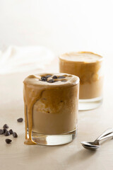 Affogato with Ice Cream, coffee glass with whipped cream and syrop, bright background