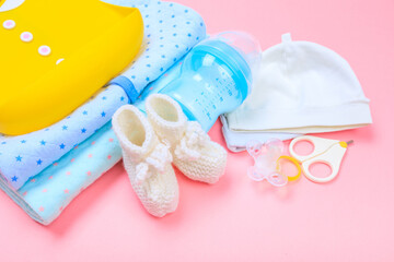 Baby concept. Baby cloth and goods on pastel pink background. Place for text. View from above. Flat Lay- Image