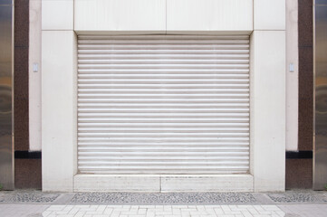 A closeup shot of automatic metal roller door used in factory, storage, garage, and industrial...