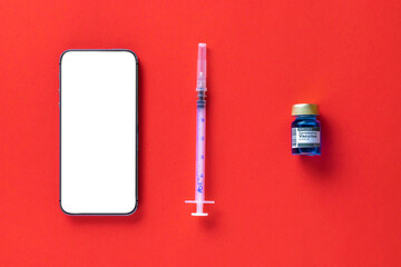 Medical application. Hospital equipment: doctor stethoscope, healthcare charts, syringe with needle and black smartphone with blank screen on red background.. Mockup generic device.