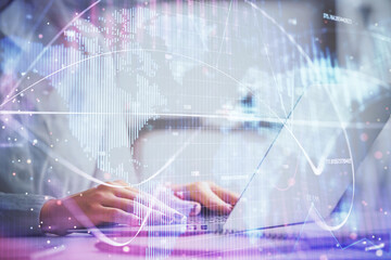 Multi exposure of woman hands typing on computer and business theme hologram drawing. Success concept.