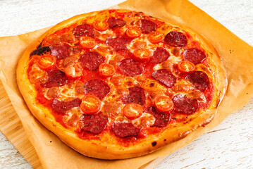 homemade pizza with sausage and sauce