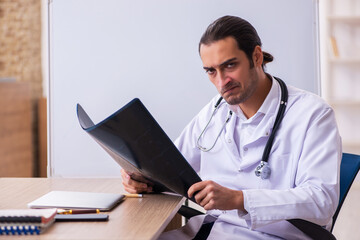 Young male doctor radiologist working in the clinic
