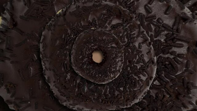 Chocolate donuts psychedelic background. Simple motion graphics food concept animated geometric pattern