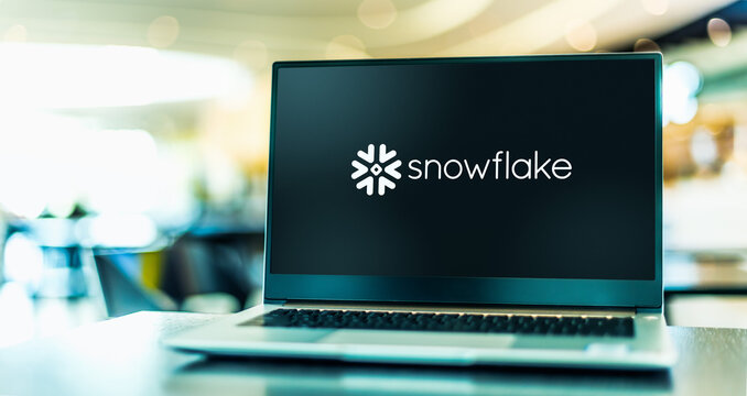 Laptop computer displaying logo of Snowflake