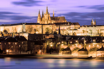 Fototapeta na wymiar Prague Castle with surrounding buildings across the river