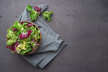 Salad mix leaves background. Fresh salad pattern with rucola, purple lettuce, spinach, frisee and...