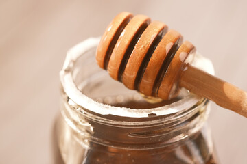 fresh honey with spoon on table 
