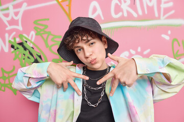 Yo look at me. Self satisfied cool fourteen years old guy males rap gesture wears fashionable...