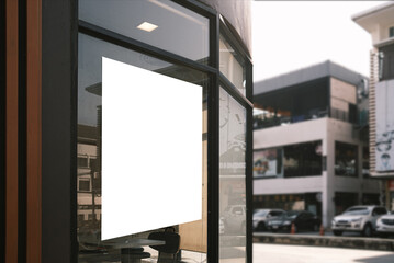 Mockup white poster or white paper promotion  displayed on the front of the restaurant, coffee shop promotion information for marketing announcements and details