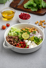 salad made of green veggies, lettuce, cottage cheese, beans, and legumes