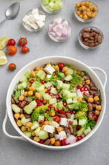 salad made of green veggies, lettuce, cottage cheese, beans, and legumes