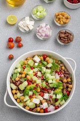 salad made of green veggies, lettuce, cottage cheese, beans, and legumes