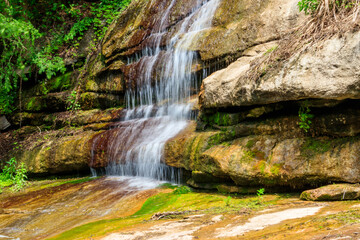 Fototapeta na wymiar Beautiful waterfall in Sofiyivka park in Uman, Ukraine