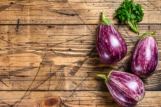 Premium Photo  Scarlet eggplant on a wooden board and wooden background