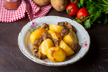 From traditional delicious Turkish food; potato and meat dish in casserole (Turkish name; Guvec tas kebabi, tandir)