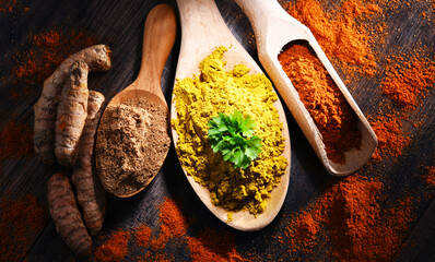 Composition with spices on wooden kitchen table