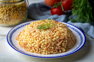 Traditional delicious Turkish food; Couscous pilaf with vermicelli (Turkish name; Sehriyeli kuskus pilavi)
