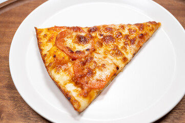 Thinly sliced pepperoni is a popular pizza