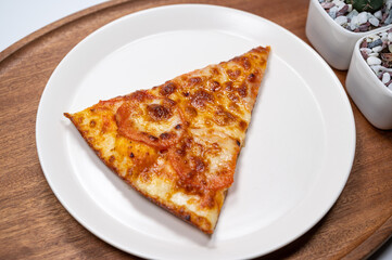 Thinly sliced pepperoni is a popular pizza