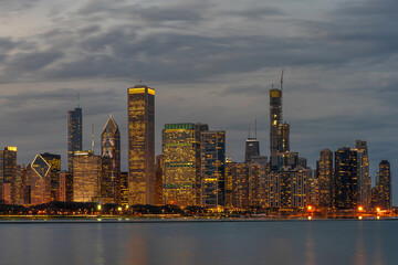 Fototapeta na wymiar Chicago Cityscape river side along Lake Michigan at beautiful twilight time, Illinois, United States, building and real estate, Business Architecture and building, travel and tourist concept