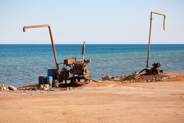 On the shore there are two pump pumps for pumping sea water on the coast of the Red Sea.