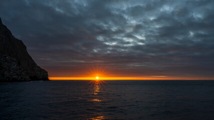 Sun sets at Wolf Island of Galapagos, one of the best dive destinations.