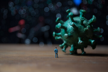 Defocused Businessman standing with corona virus or covid19 in cloudy background, Corona virus...