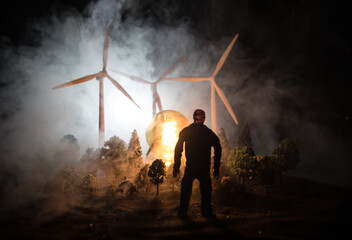 Obraz premium concept idea eco power energy. wind turbine on hill with sunset. Wind Turbine producing alternative energy.