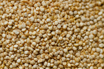 Grain of quinoa. Uncooked raw quinoa as background. Healthy vegan food concept and pattern