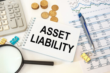Business concept - notebook writing Asset Liability