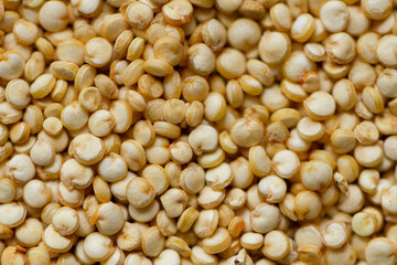 Grain of quinoa. Uncooked raw quinoa as background. Healthy vegan food concept and pattern