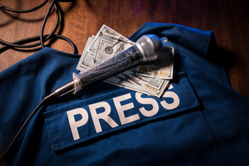 Media Journalism fake news concept. Blue journalist (press) vest in dark with backlight and fog....