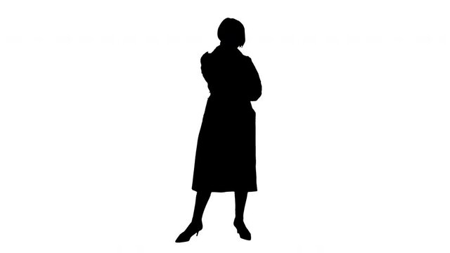 Silhouette Grandmother calling. Loving fashionable modern grandmother wearing pink trench coat making a call.